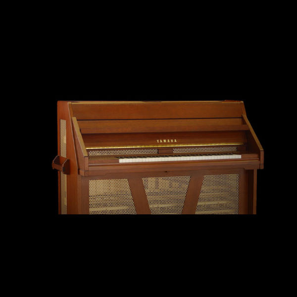 A brown wooden Yamaha Celesta, a keyboard musical instrument resembling an upright piano, with visible white and black keys and a gold Yamaha logo.