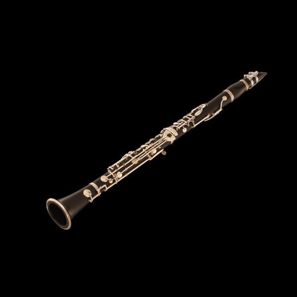 Black Bb clarinet in B, a woodwind musical instrument with silver keys, isolated on a black background.
