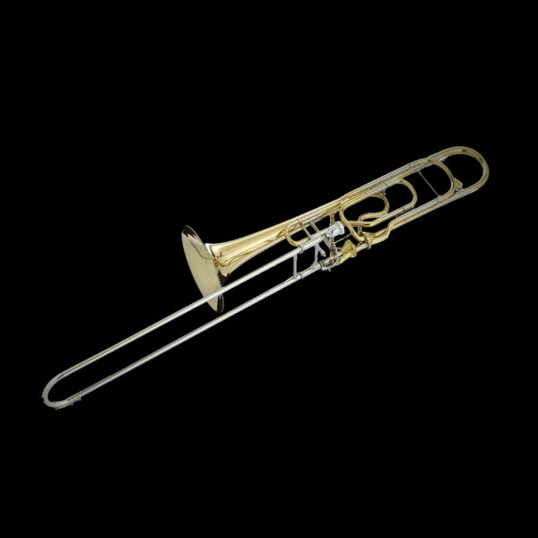 Gold Kontrabassposaune in F, also known as contrabass trombone, with silver slide components against a dark background.