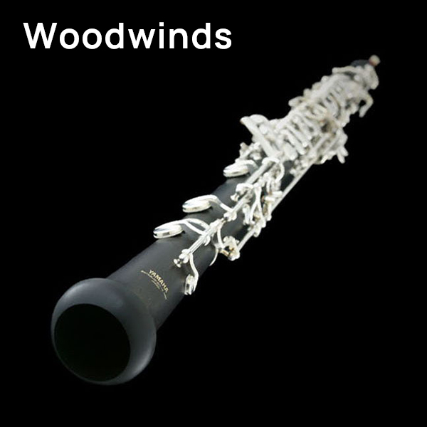 Yamaha oboe, black woodwind instrument with silver keys, on a black background, representing woodwind musical instruments.