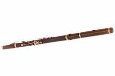 Dark brown concert flute with silver keys, laid horizontally.